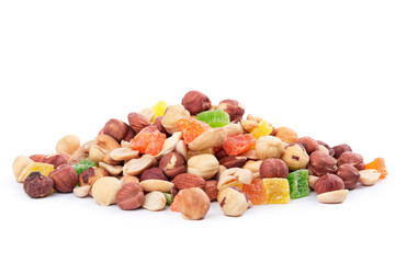 Pile of toasted nuts and candied fruit isolated on white background