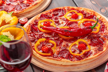 Homemade cheese pizza with salami