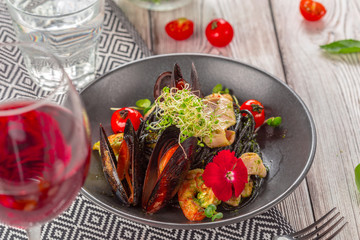Grilled seafood salad on wooden table