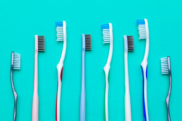 Flat lay composition with manual toothbrushes on color background, close up