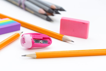 Naklejka premium Pencil and pencil sharperner on white paper background