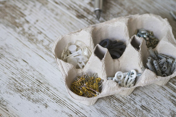 An egg box recycled as DIY items container