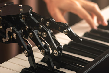 Human with neural hand prosthesis playing piano