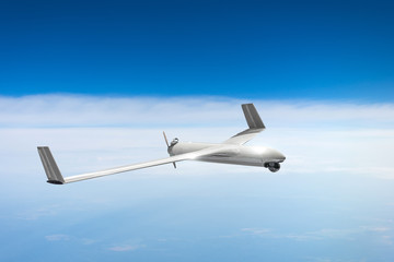 Unmanned military drone on patrol air sky at high altitude.