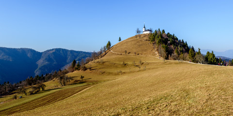 Church on a hill Sv. Jakob in Slovenia countryside.