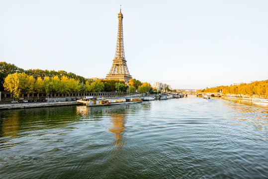 Landscape view of the riverside with Eiffel tower during the morning light in Paris