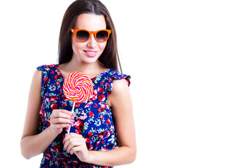 Obraz premium Smiling girl holding candy lollipop.