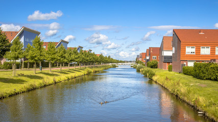 Obraz premium Natural Canal in modern suburb neigborhood