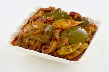 Mix Achar, A pure Desi traditional dish of mix vegetables stuffed with spices & dipped in thick oil and necessary for every dastarkhan.  