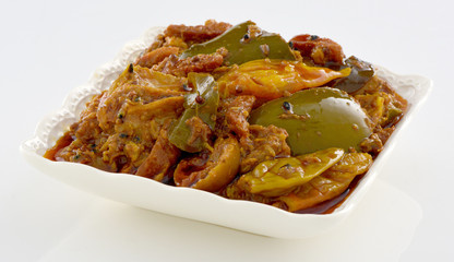 Mix Achar, A pure Desi traditional dish of mix vegetables stuffed with spices & dipped in thick oil and necessary for every dastarkhan.  