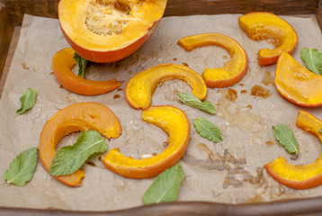 Pumpkin baked in the oven. Delicious autumn lunch. Top view. Copy space.