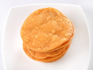 Papri, a crispy fried dough wafers used especially with chana chaat and dahi bhalle