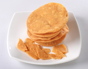 Papri, a crispy fried dough wafers used especially with chana chaat and dahi bhalle