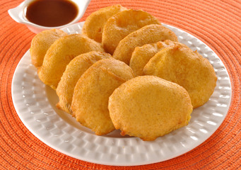 Fototapeta na wymiar Potato Pakora with chutney, a traditional light tea time snack