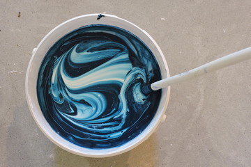 White paint with blue dye - obrazy, fototapety, plakaty