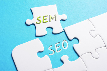 The Words SEO And SEM In Missing Piece Jigsaw Puzzle