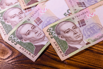Ukrainian five hundred hryvnas banknotes on wooden table
