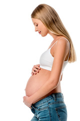 side view of attractive pregnant woman touching her belly isolated on white