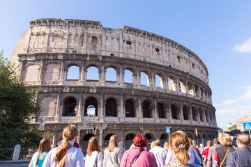 The Coliseum in Rome. Tourists admire the view of the Colosseum. Italy