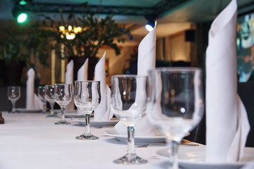 Empty wine glass on the banquet table.Table setting for a banquet or dinner party.