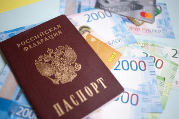 Moscow, Russia- 08 28 2018: Russian passport. The Russian Currency, including the new 2000 ruble-denominated promissory notes. The MIR credit card