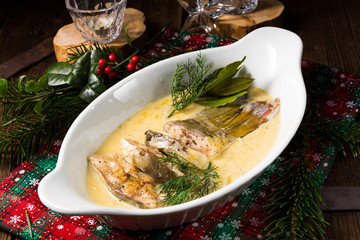 fried christmas carp in butter sauce with dill and lemon