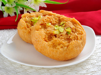 Makhan Bara or Buttery Puff is a famous and delicious sweet food in South Asian Countries