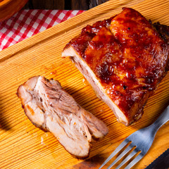 spicy roasted meat with mushroom sauce in the oven