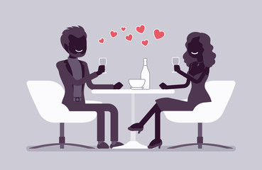 Couple enjoy romantic dinner in restaurant