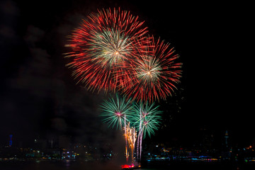 Colorful fireworks of various colors at night with celebration and anniversary concept