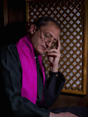 Portrait of a priest in his confessional