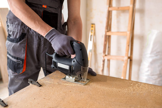 Handyman using a jig saw for carpentry work