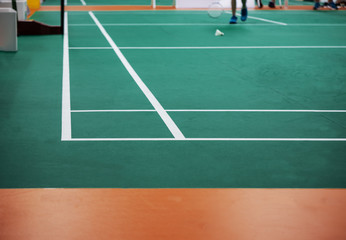 Fototapeta premium Indoor badminton court,shuttle cock on the floor, selective focus