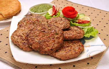 Zelfklevend Fotobehang Chapli Kebabs or Chapli Kababs, Famous Food of Peshawar Pakistan © Jehangir Hanafi