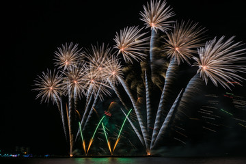 Colorful fireworks of various colors at night with celebration and anniversary concept