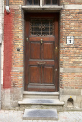 Fototapeta na wymiar old door in brick wall