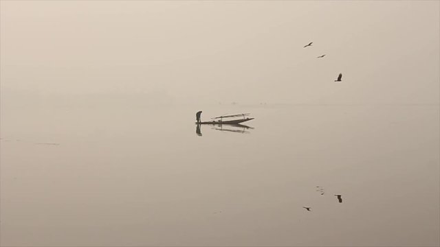 Fisherman fishing on a lake