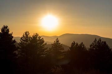 Fototapeta na wymiar Golden sunset panorama of Zlatibor mountain. Tourist destination in Serbia.