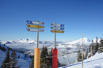 Direction signs for skiers on the slopes above Avoriaz in the French Alps. - obrazy, fototapety, plakaty