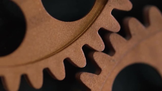 close up on clock's wheels running: time passing, symbol