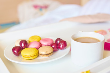 Romantic breakfast with macarons and coffee
