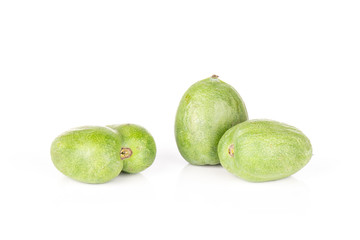 Set of three whole fresh green mini baby kiwi fruit isolated on white background