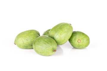 Group of five whole fresh green mini baby kiwi fruit isolated on white background