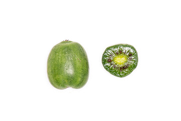 Group of one whole one half of fresh green mini baby kiwi fruit flatlay isolated on white background