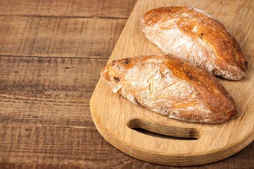 Ciabatta buns on wooden table