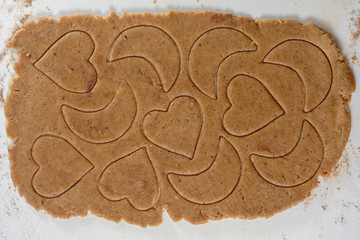 ginger dough with ornament from heart and moon on the white table