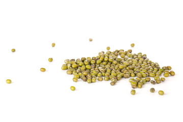 Lot of whole dry green mung beans stack isolated on white background