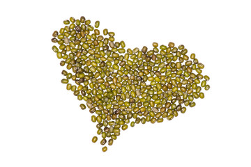 Lot of whole dry green mung beans folded like a heart flatlay isolated on white background
