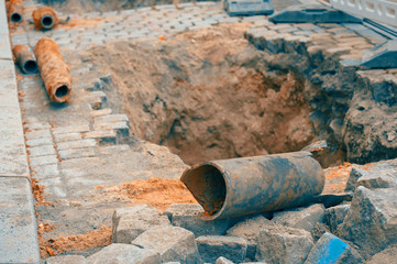 bursted Water pipe under a road - 228104523