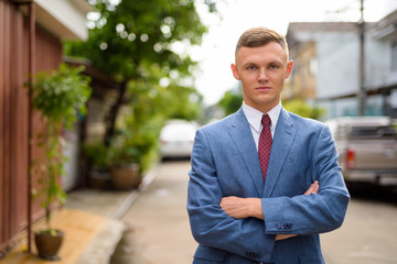 Portrait of young businessman in the streets outdoors